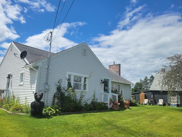 back of house featuring a yard