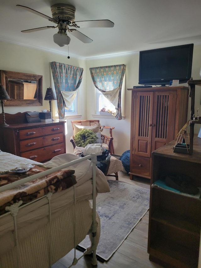 bedroom featuring ceiling fan and wood-type flooring