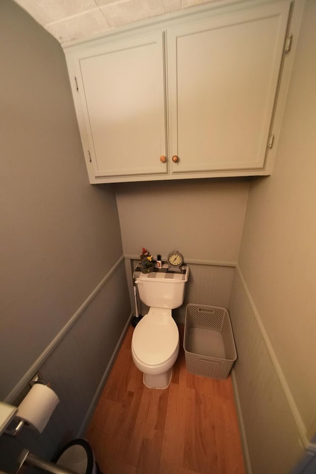 bathroom featuring toilet and hardwood / wood-style flooring