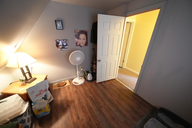 corridor with dark hardwood / wood-style floors