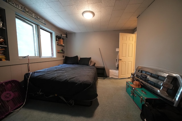 bedroom featuring light colored carpet