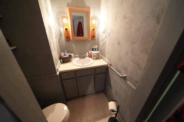 bathroom with vanity, tile flooring, and toilet