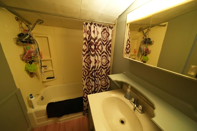 bathroom featuring shower / bath combination with curtain and vanity