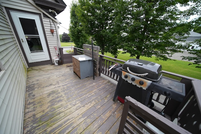 wooden deck featuring area for grilling