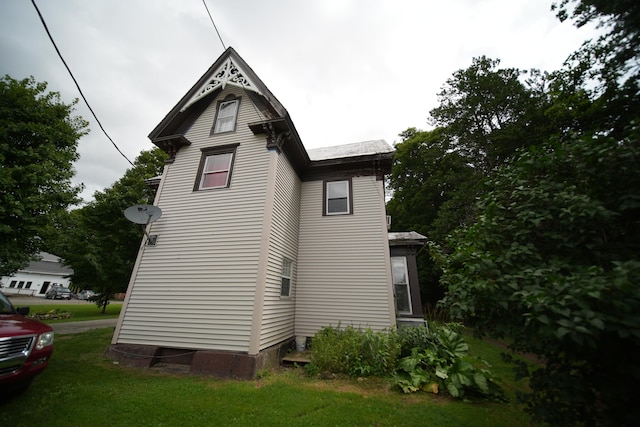 view of property exterior featuring a yard