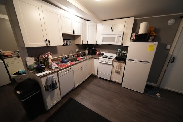 kitchen with sink, white appliances, dark hardwood / wood-style floors, and white cabinetry