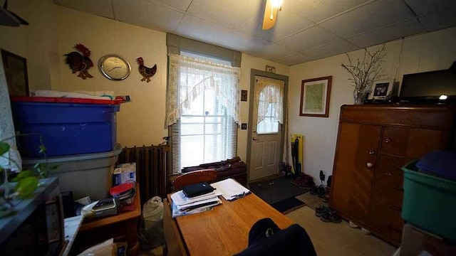 office space with plenty of natural light and a drop ceiling