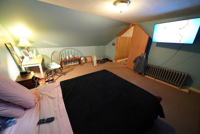 bedroom featuring lofted ceiling and carpet