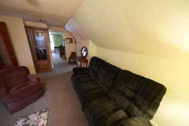 carpeted living room with lofted ceiling