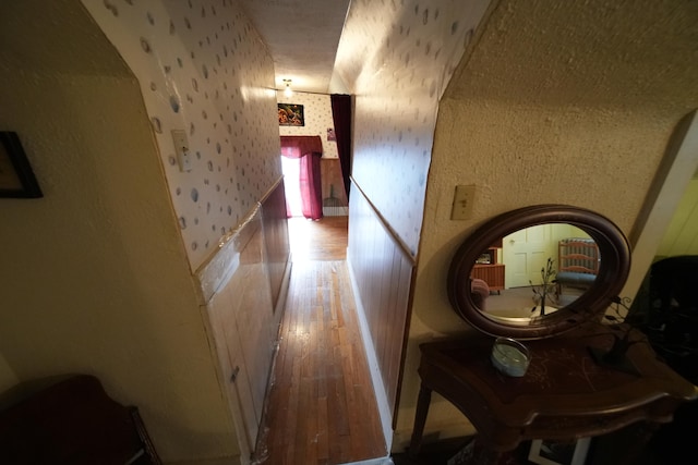 hallway with wood-type flooring