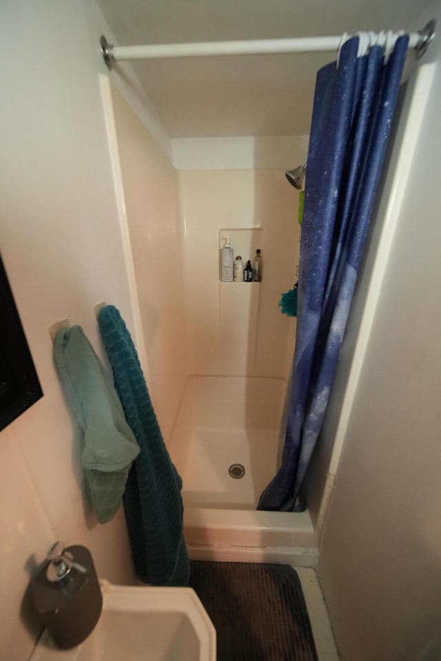 bathroom with a shower with curtain