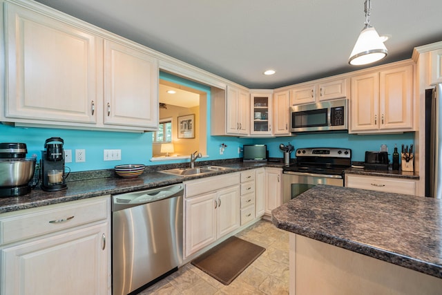 76 Heritage Dr Unit 5, Wells, ME 04090 - kitchen with appliances with stainless steel finishes, a sink, glass insert cabinets, decorative light fixtures, and recessed lighting