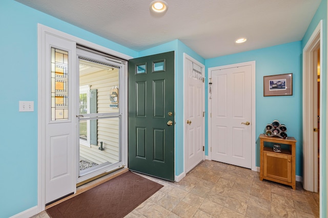 76 Heritage Dr Unit 5, Wells, ME 04090 - foyer entrance featuring baseboards, recessed lighting, and light stone finish floors