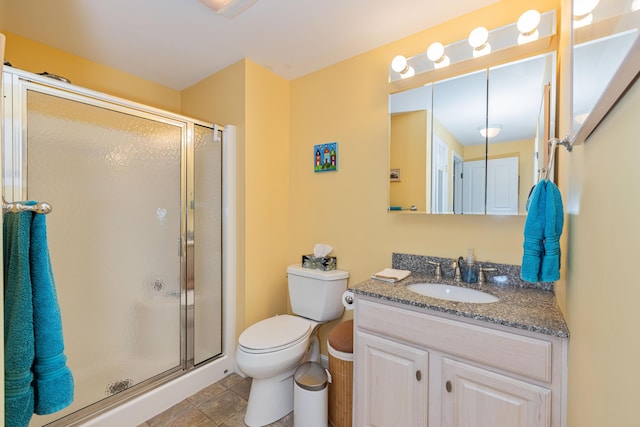 76 Heritage Dr Unit 5, Wells, ME 04090 - bathroom featuring toilet, vanity, and a shower stall