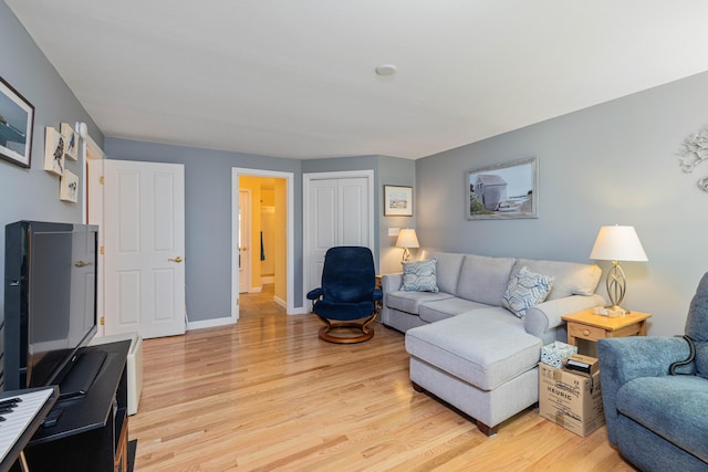 76 Heritage Dr Unit 5, Wells, ME 04090 - living room featuring light wood-style floors and baseboards