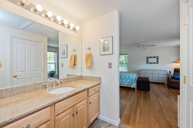 76 Heritage Dr Unit 5, Wells, ME 04090 - ensuite bathroom with vanity, healthy amount of natural light, ceiling fan, and wood finished floors