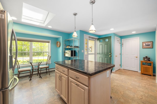 76 Heritage Dr Unit 5, Wells, ME 04090 - kitchen featuring stainless steel fridge with ice dispenser, a baseboard radiator, a skylight, recessed lighting, and a kitchen island
