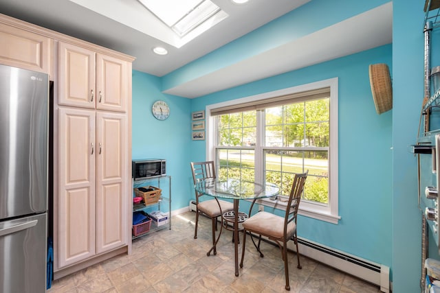 76 Heritage Dr Unit 5, Wells, ME 04090 - dining room with baseboards, recessed lighting, stone finish floors, baseboard heating, and a skylight