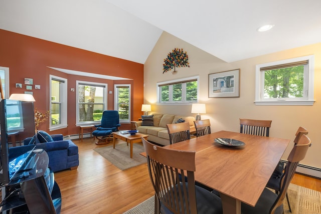 76 Heritage Dr Unit 5, Wells, ME 04090 - dining space with a baseboard heating unit, light wood-style flooring, high vaulted ceiling, and recessed lighting