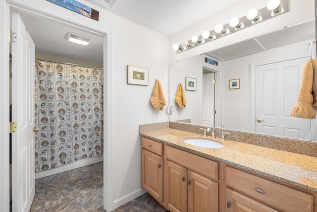 76 Heritage Dr Unit 5, Wells, ME 04090 - bathroom with vanity, baseboards, curtained shower, and stone finish floors