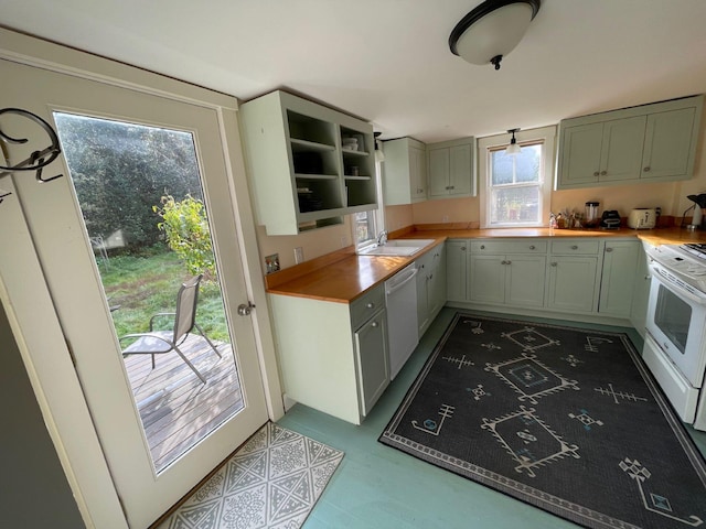 122 Main St, Cranberry Isles, ME 04646 - kitchen featuring white appliances, sink, and light tile floors