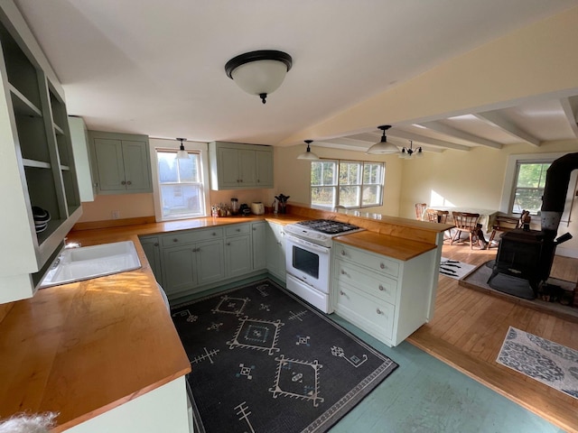 122 Main St, Cranberry Isles, ME 04646 - kitchen featuring ceiling fan, hardwood / wood-style flooring, white range with gas stovetop, and a healthy amount of sunlight