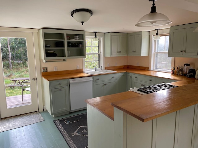 122 Main St, Cranberry Isles, ME 04646 - kitchen featuring white dishwasher, a healthy amount of sunlight, decorative light fixtures, and light wood-type flooring