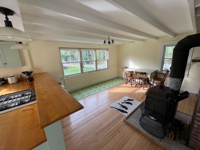 122 Main St, Cranberry Isles, ME 04646 - living room featuring beam ceiling and light hardwood / wood-style floors