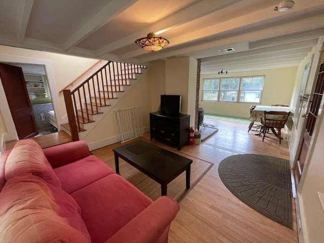 122 Main St, Cranberry Isles, ME 04646 - living room featuring light wood-type flooring, beam ceiling, and french doors