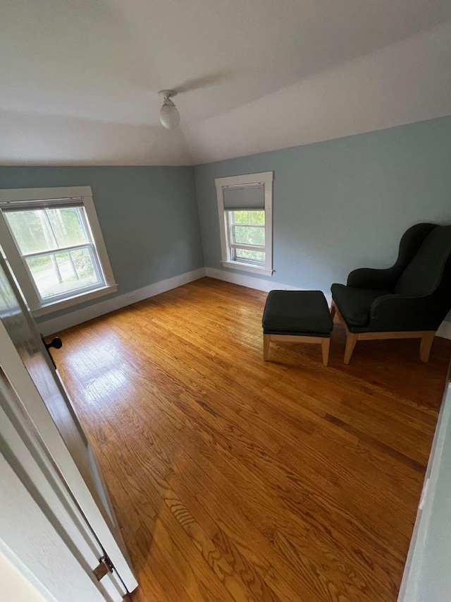 122 Main St, Cranberry Isles, ME 04646 - sitting room with lofted ceiling and light wood-type flooring