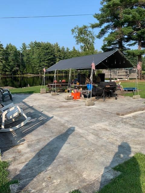 view of patio with a water view