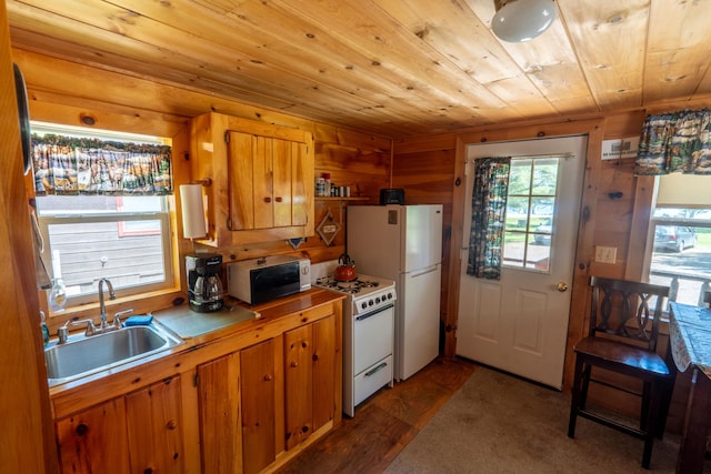 kitchen featuring white appliances, wooden ceiling, sink, and wood-type flooring