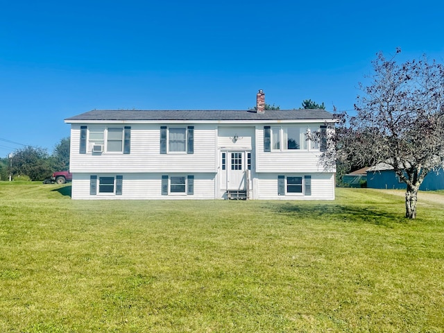 rear view of house with a lawn