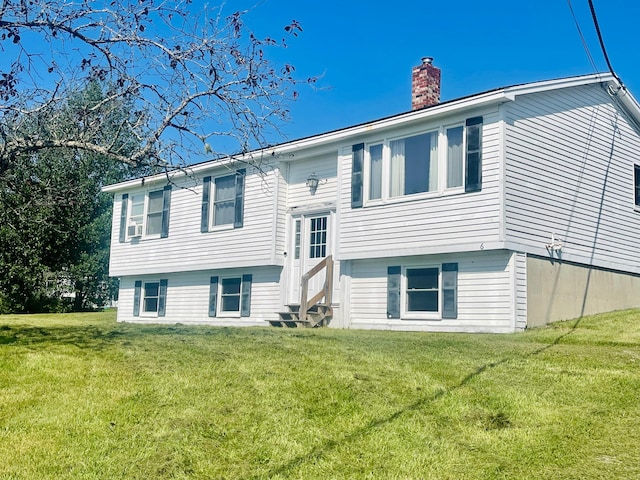 raised ranch featuring a front yard