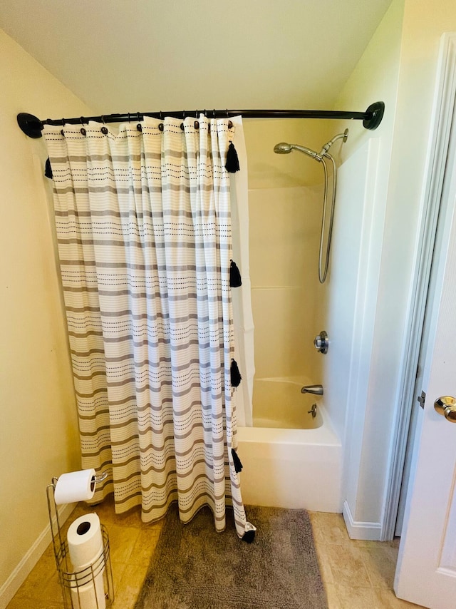 bathroom featuring tile floors and shower / bath combo