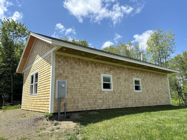 view of property exterior featuring a yard