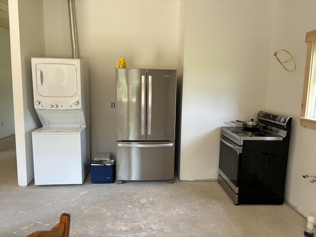 laundry area featuring stacked washer and dryer