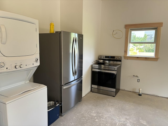 kitchen with stainless steel appliances and stacked washer / dryer