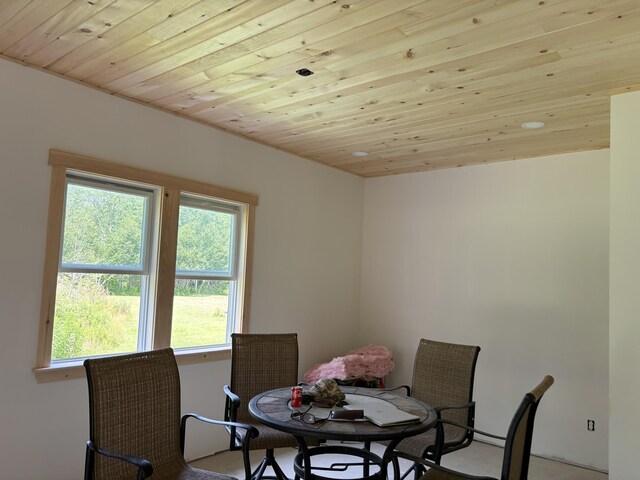 dining space featuring wooden ceiling