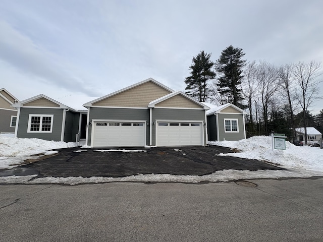 view of front of property with driveway and an attached garage