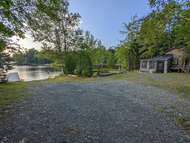 32 N Mud Cove Rd, Lily Bay Twp, ME 04441 - yard at dusk featuring a water view
