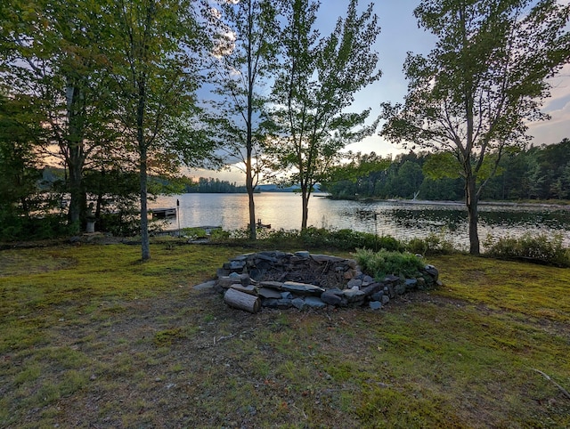 yard at dusk with a water view