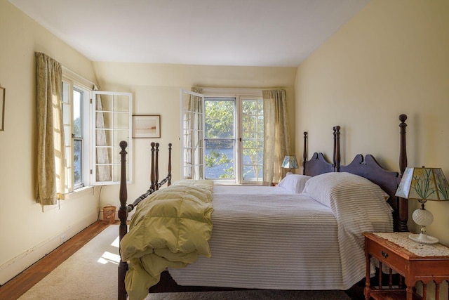 bedroom with wood-type flooring