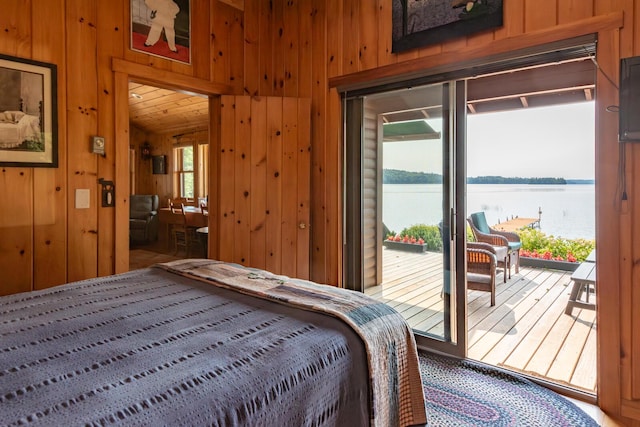 228 Starbird Ln, Rome, ME 04963 - bedroom featuring wooden walls and access to exterior