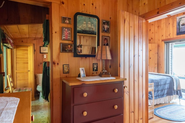 228 Starbird Ln, Rome, ME 04963 - bedroom with wood walls and ensuite bathroom