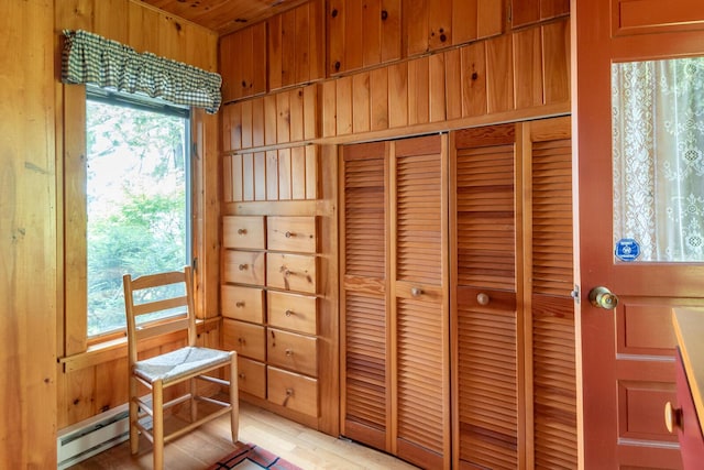 228 Starbird Ln, Rome, ME 04963 - doorway to outside featuring a baseboard radiator and wood walls