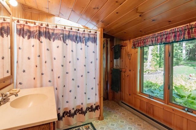 228 Starbird Ln, Rome, ME 04963 - bathroom with a baseboard heating unit, vaulted ceiling, wood walls, wooden ceiling, and vanity