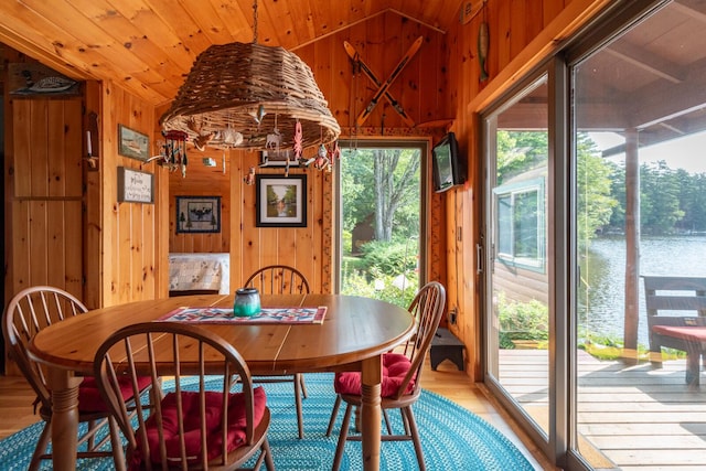228 Starbird Ln, Rome, ME 04963 - dining area featuring wood walls, wood finished floors, vaulted ceiling, and wood ceiling