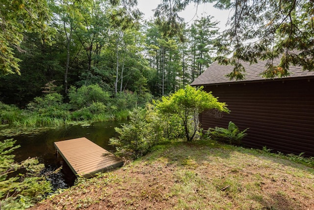 228 Starbird Ln, Rome, ME 04963 - view of yard with a dock and a water view