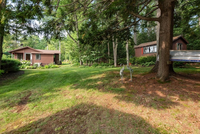 228 Starbird Ln, Rome, ME 04963 - view of grassy yard featuring view of wooded area